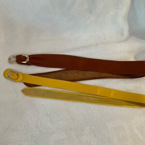 Two lovely soft leather belts with golden buckles